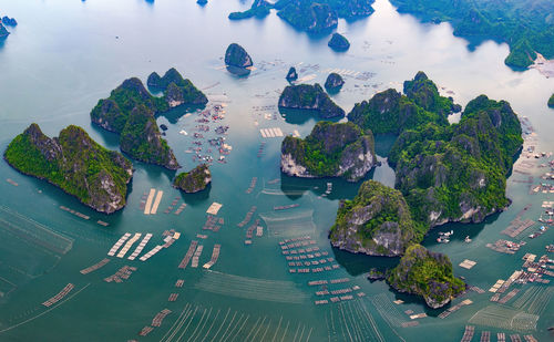 High angle view of trees and sea against sky