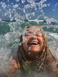 Happy woman enjoying in sea