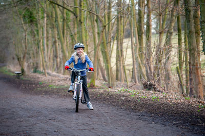 Man riding bicycle in forest