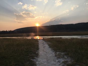 Scenic view of lake against sky during sunset