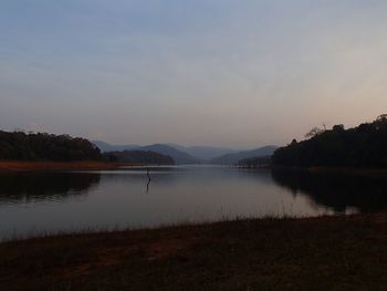 Scenic view of lake against sky during sunset