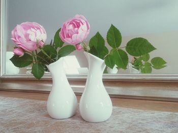 Close-up of pink rose in vase