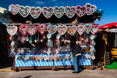 Low angle view of multi colored hanging for sale at market stall