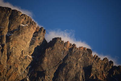 Low angle view of rock formation against sky