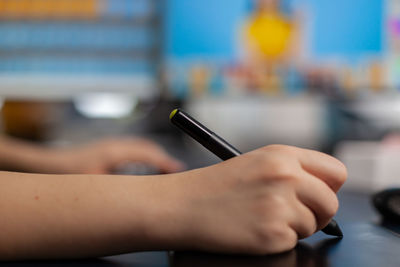 Close-up of woman hand using mobile phone