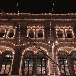 Low angle view of illuminated building at night