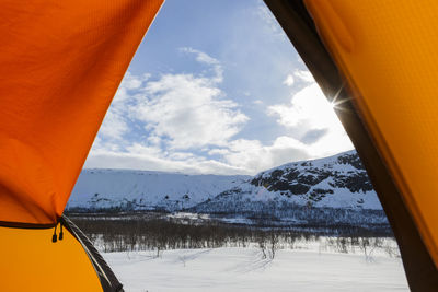 Winter landscape seen through tent entrance