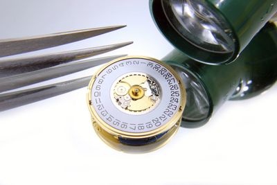 Close-up of clock on table