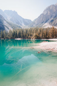 Scenic view of lake and mountains against sky