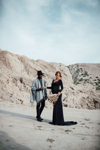 Friends standing on a desert