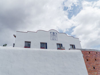 Low angle view of building against sky during winter