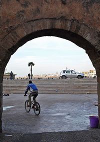 Bicycle on city against sky