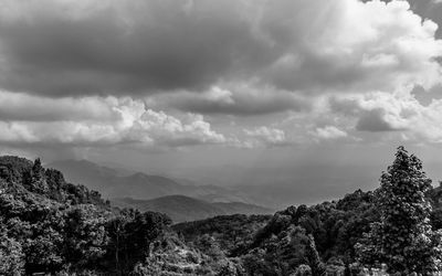 Scenic view of tree mountains against sky