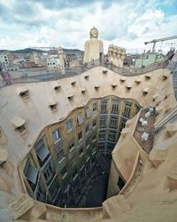 Aerial view of city against sky