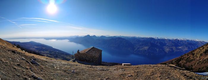 Panoramic view of mountains against blue sky