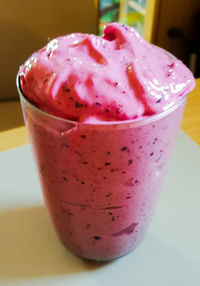 Close-up of ice cream in glass on table