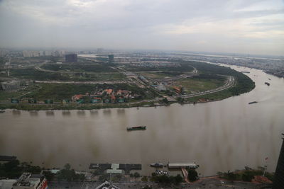 High angle view of buildings and city against sky