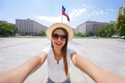 Self portrait of traveler girl visiting the city center of santiago, chile, south america