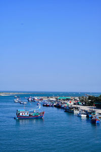 Scenic view of sea against clear blue sky