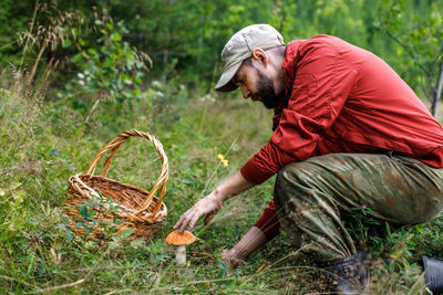 Rear view of man working in farm