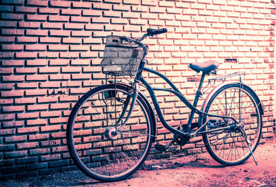 Bicycle against brick wall