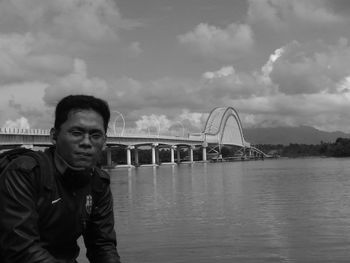 Portrait of man against bridge against sky