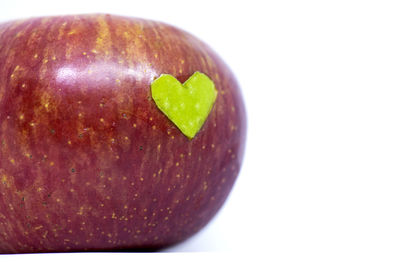 Close-up of apple against white background