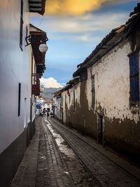 Street amidst buildings against sky