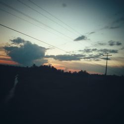 Low angle view of silhouette trees against sky during sunset