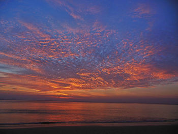 Scenic view of sea against dramatic sky