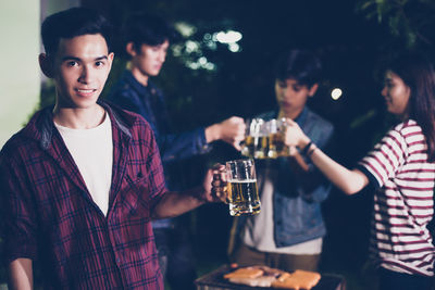 Young couple in a drinking glass