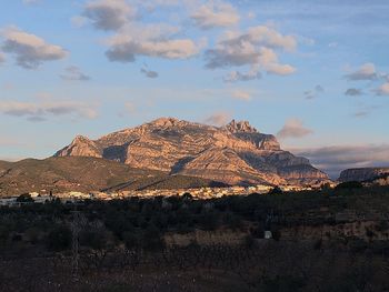 View of mountain range against cloudy sky