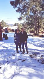 Full length of happy woman on field during winter