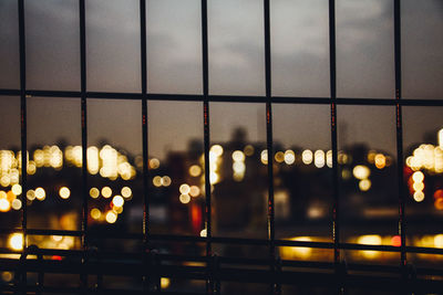 Defocused image of illuminated street lights at night