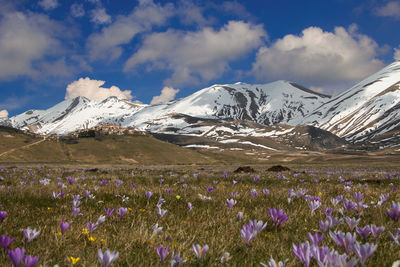 Scenic view of snowcapped mountains against sky