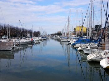 Boats moored at harbor