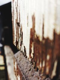 Close-up of rusty wheel against blurred background