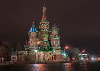 Illuminated buildings in city at night