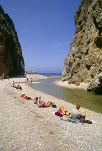 Scenic view of beach against blue sky