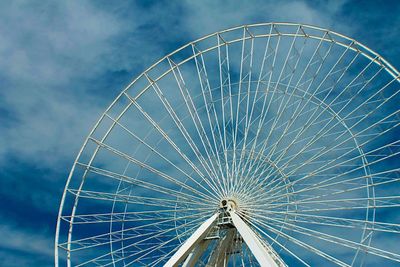 Low angle view of ferris wheel against sky