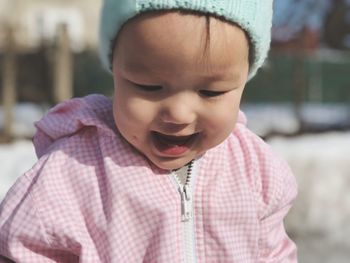 Close-up of cute baby girl wearing warm clothing