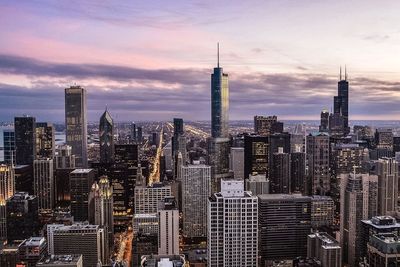 City skyline against cloudy sky