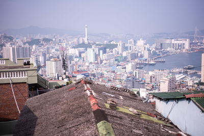 View of cityscape with river in foreground