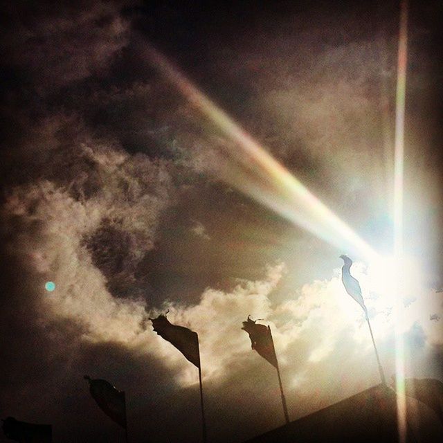 low angle view, sky, illuminated, cloud - sky, lighting equipment, street light, electricity, light - natural phenomenon, built structure, night, no people, rainbow, outdoors, architecture, weather, lens flare, cloudy, sunbeam, nature, auto post production filter