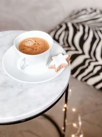 High angle view of coffee cup on table