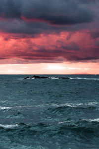 Scenic view of sea against dramatic sky