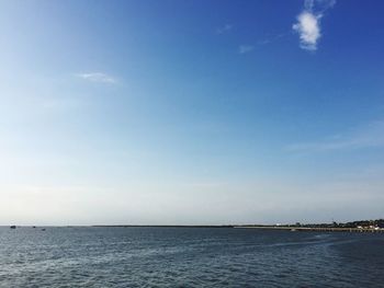 Scenic view of sea against blue sky