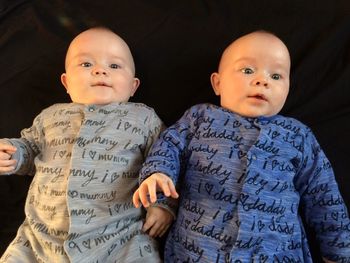 High angle view of baby boys on bed