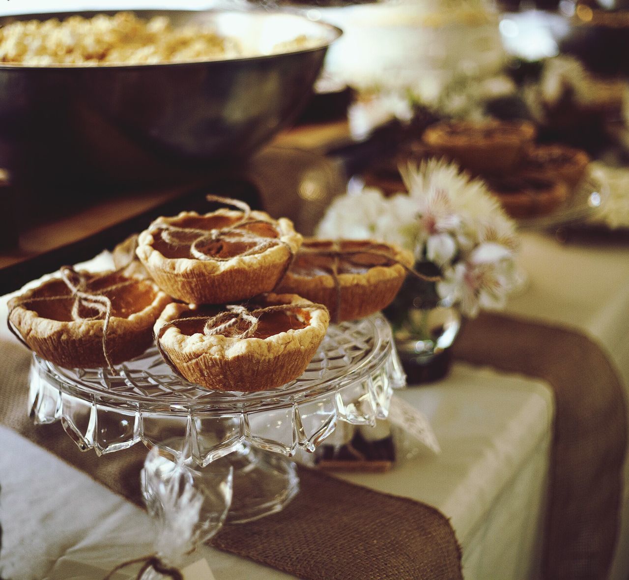 indoors, table, freshness, food and drink, still life, focus on foreground, sweet food, close-up, food, dessert, flower, plate, indulgence, ready-to-eat, vase, unhealthy eating, no people, home interior, glass - material, day