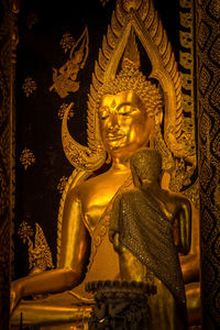 Buddha statue in temple outside building
